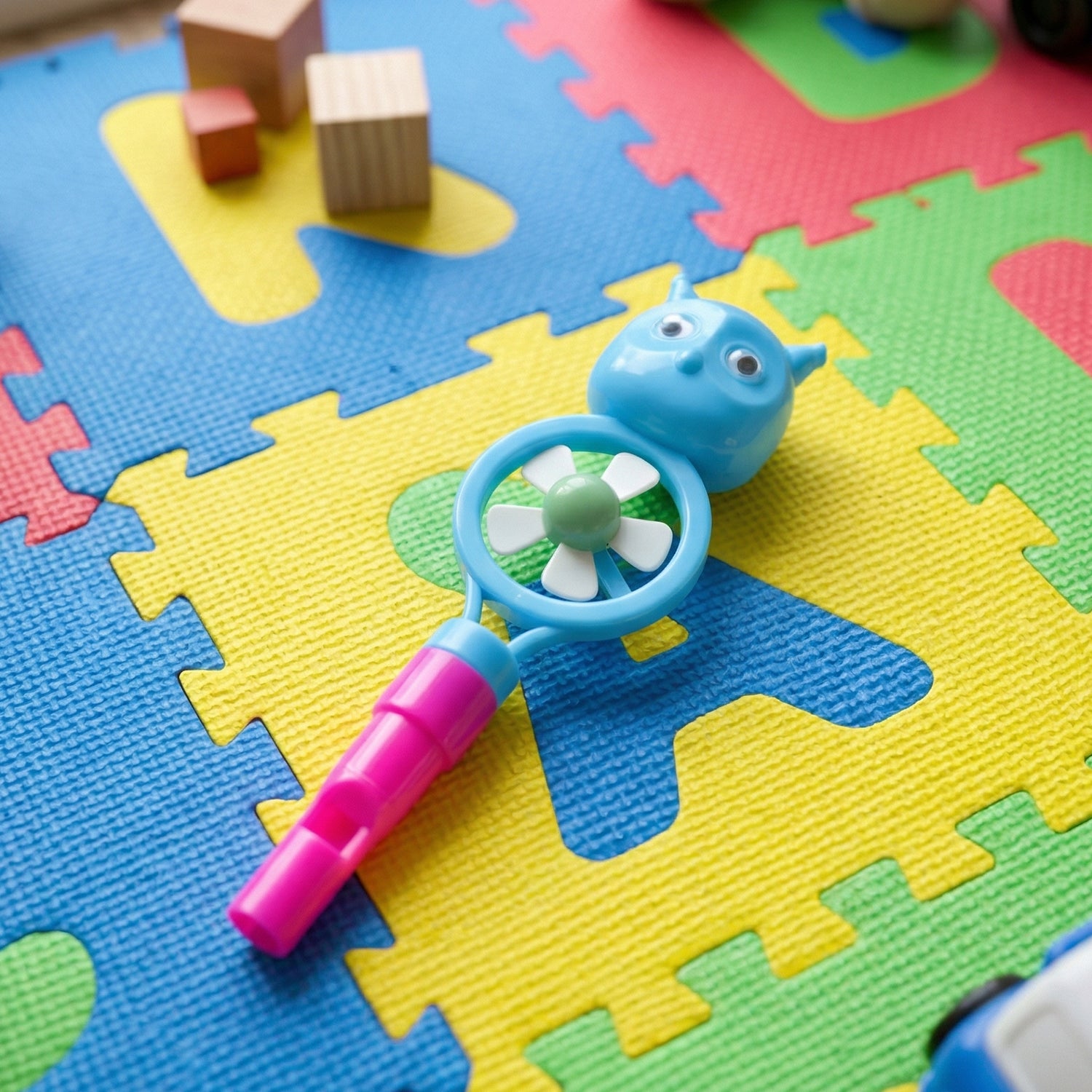 Kids toothbrush set with cartoon whistle fan by Wukusy, featuring colorful handles and playful design for children.