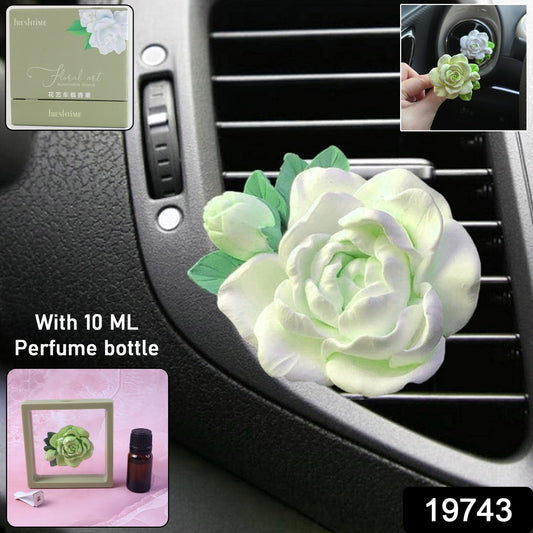 Wukusy elegant rose flower car air freshener clip with 10ml perfume bottle attached to an ac vent, showcasing a decorative automotive accessory.