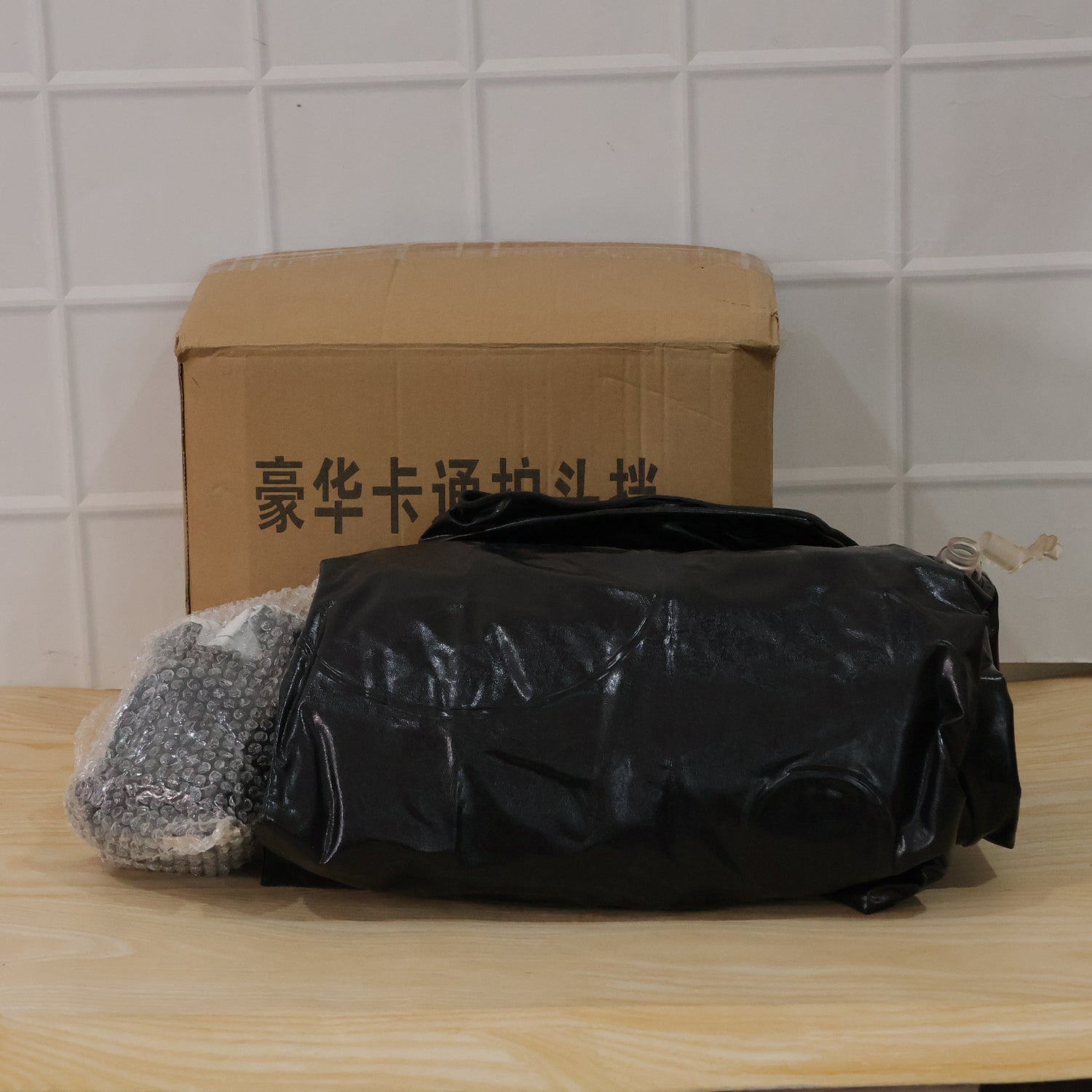 Wukusy car air mattress set with black monster pillow and cushions for kids and adults, shown inflated in a vehicle interior.