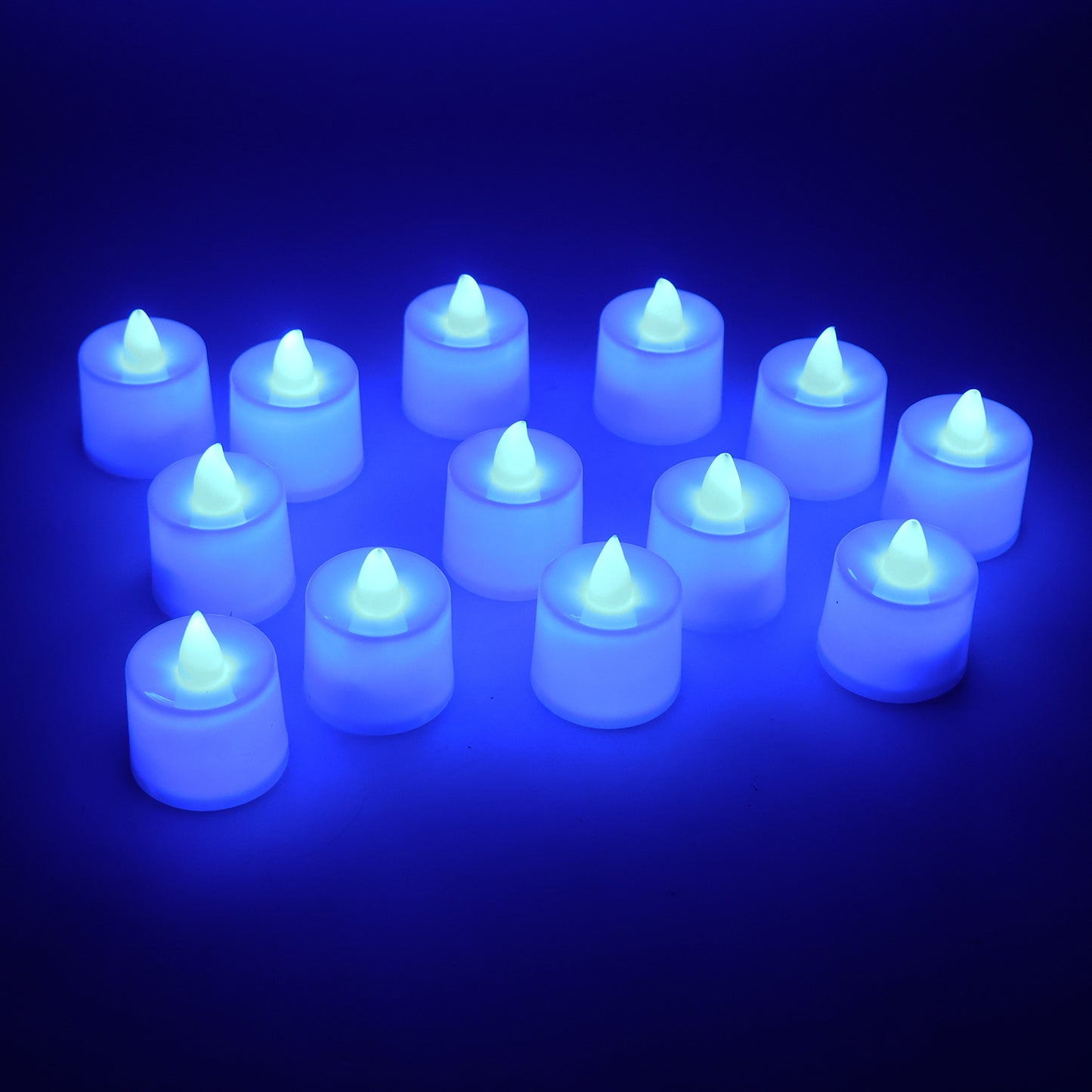 Set of 24 blue LED tea light candles by Wukusy, showing small flickering flameless candles in a dark setting