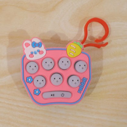 Wukusy cute cartoon music push button toy keychain with sound, featuring a colorful, playful design on a keyring.