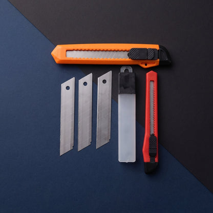 Wukusy professional utility knife cutter set with extra snap-off blades, shown with a black handle and multiple blade segments.