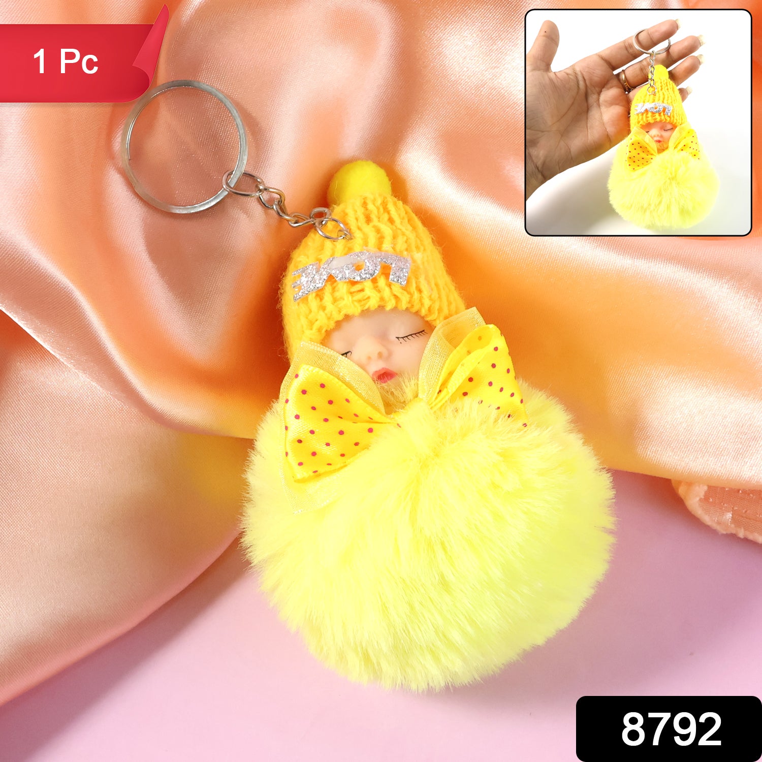 Wukusy cute doll plush keychain with soft fur ball, featuring a charming stuffed doll design and fluffy exterior.