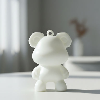 Wukusy cute bear shape mini figure keychain attached to a keyring, featuring a small, detailed bear design perfect for keys or bags