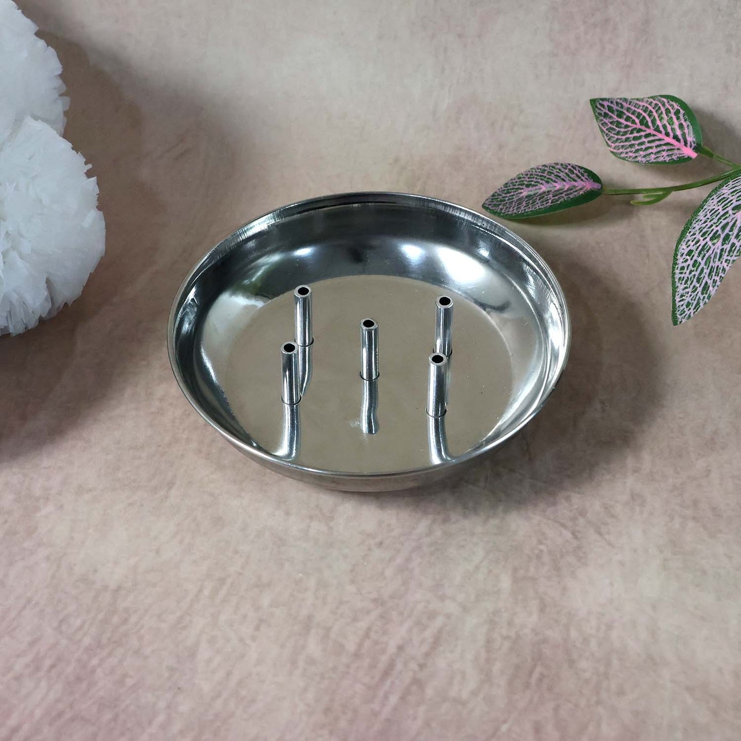 Wukusy stainless steel Agarbatti stand Sia-5 holding incense sticks, with a sleek, durable design and multiple slots for burning incense.