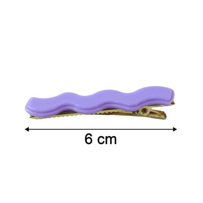 Set of four Wukusy decorative alligator hair clips for girls and women, featuring cute styling pins in vibrant colors.