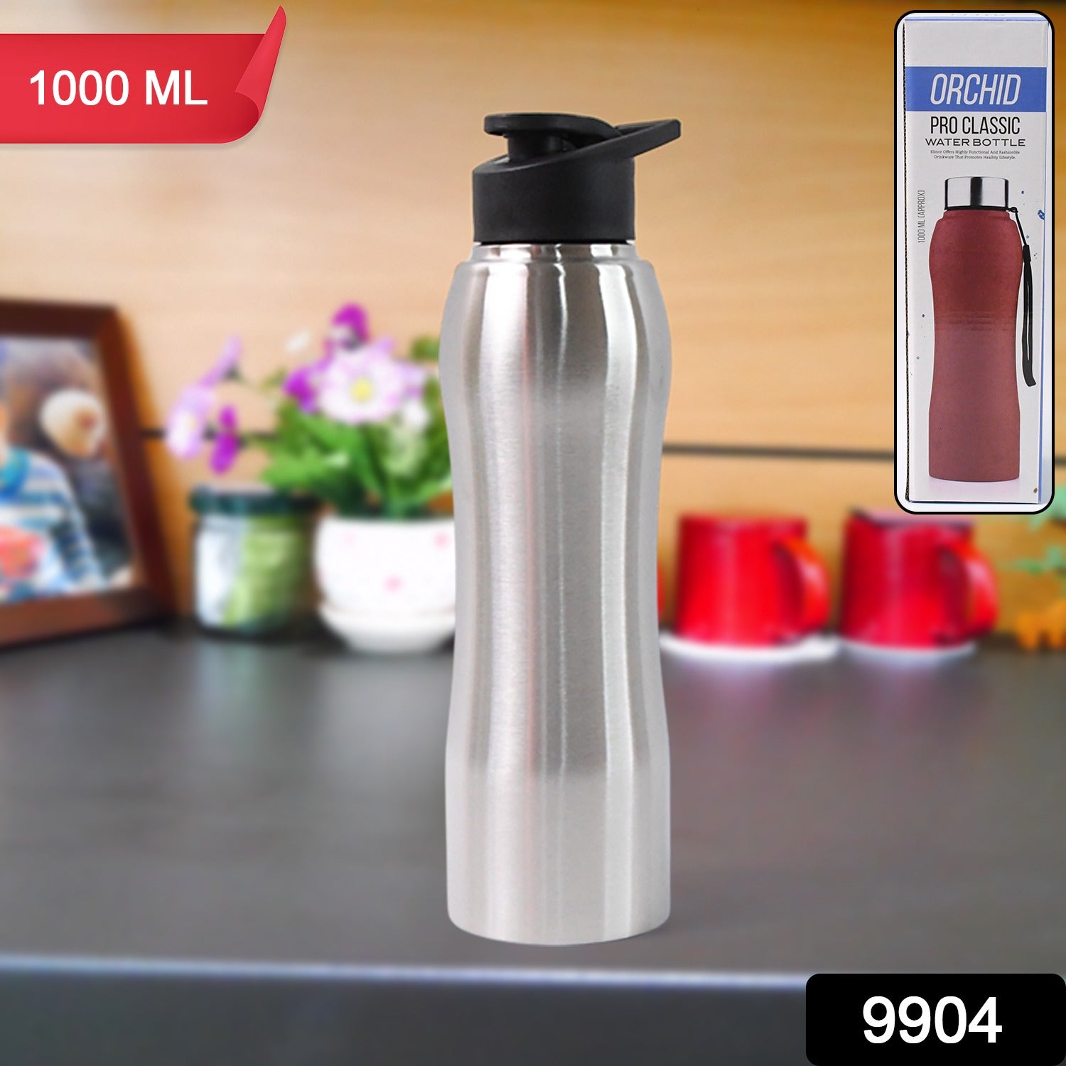 Stainless steel Wukusy double wall vacuum-insulated water bottle, 1000ml capacity, with sleek design and secure lid in a home kitchen setting.