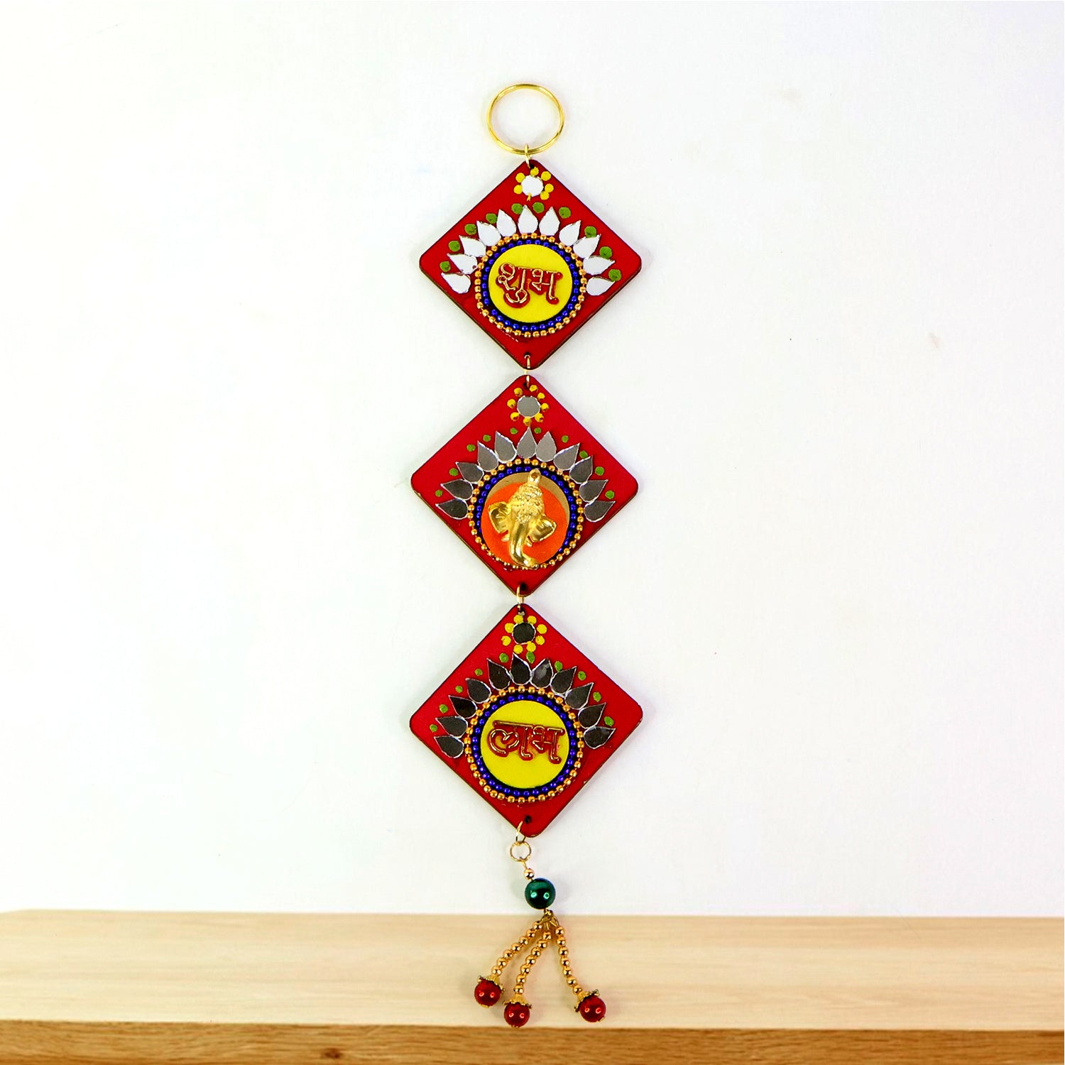 Traditional Labh Shubh decorative wall hanging from Wukusy, featuring intricate design for home decor.