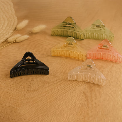 Colorful triangle-shaped plastic hair claw clip by Wukusy, durable grip for women and girls, stylish hair accessory.