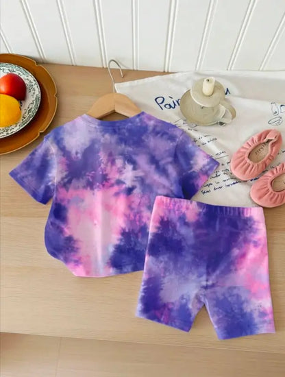 Kids tie-dye heart print summer set by ekom, purple and pink t-shirt with matching shorts, vibrant and playful casual outfit.