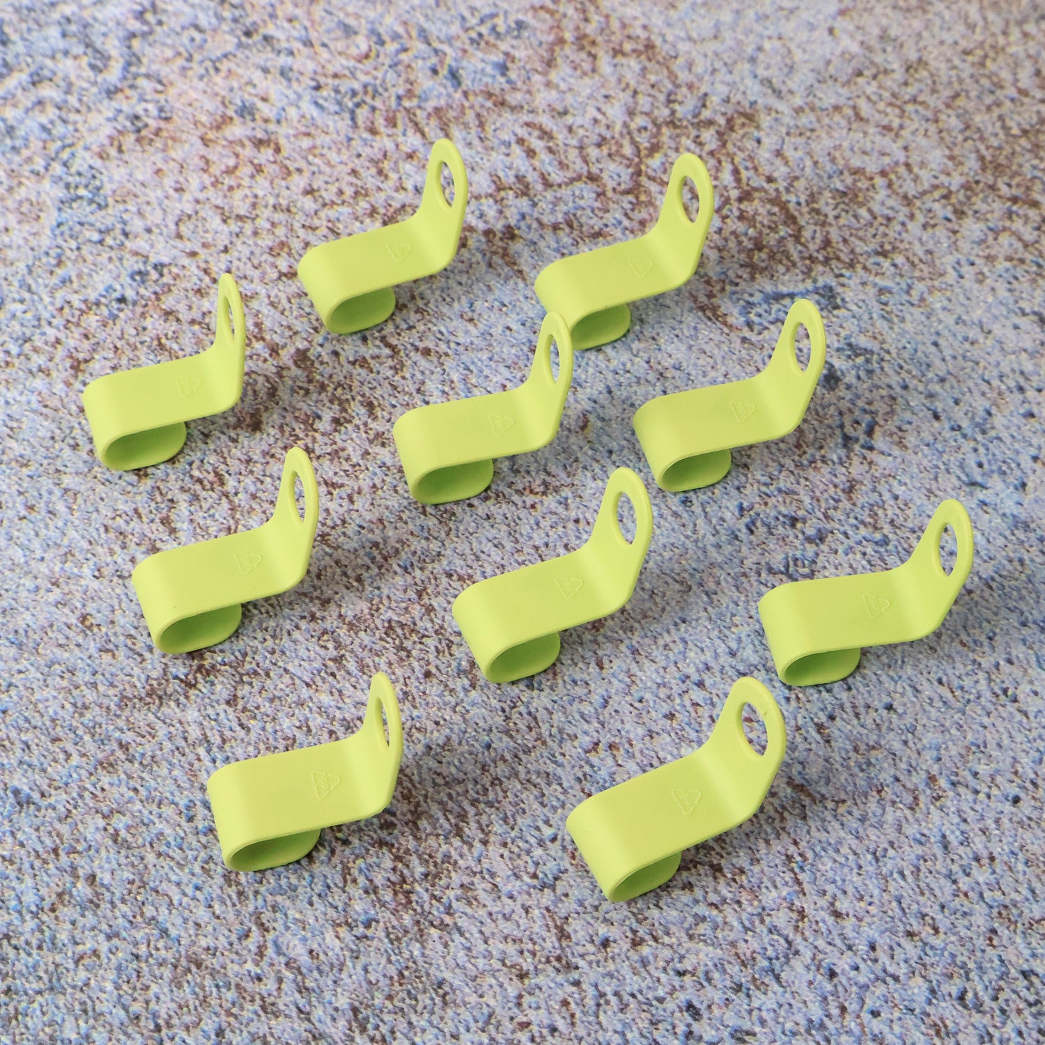 Set of 10 Wukusy plastic hanger hooks for versatile home improvement and organization, shown hanging on a closet rod.