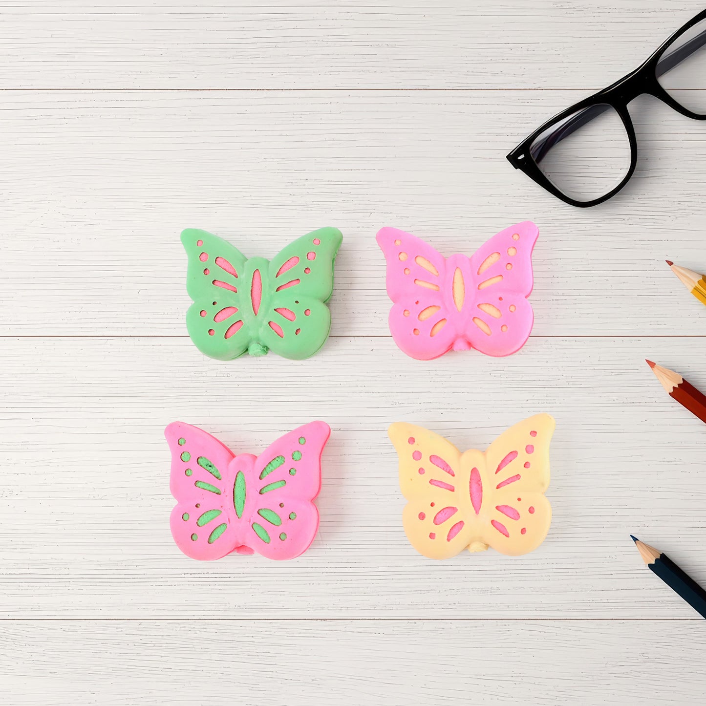 Set of 25 colorful butterfly-shaped rubber erasers by Wukusy, perfect for office and school use.