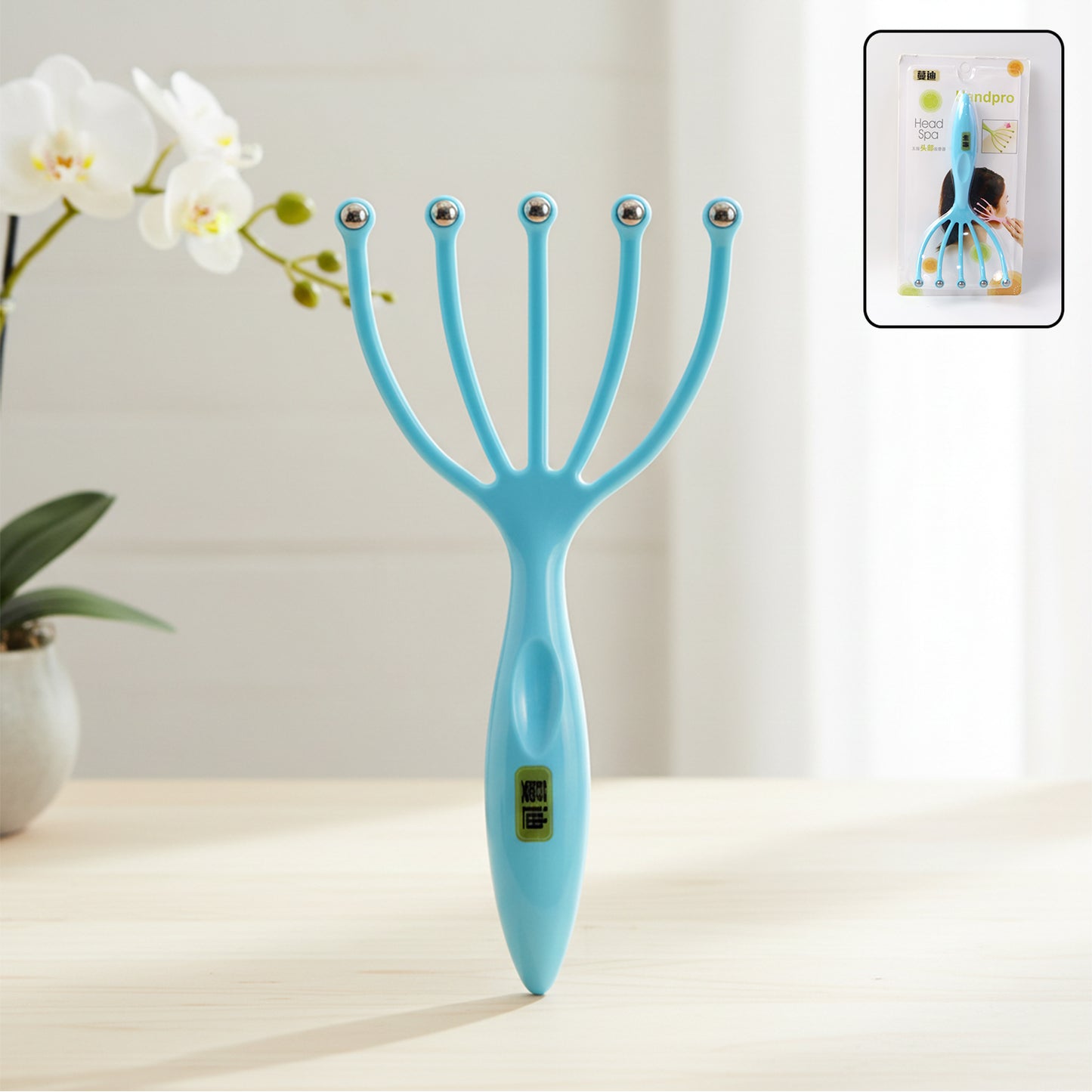 Wukusy handheld five-finger head massager with rolling ball tips showing a close-up of the black plastic massager in hand