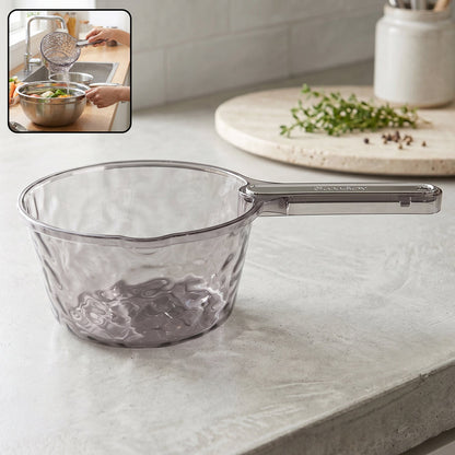 Transparent plastic water dipper scoop with handle for bathroom use, designed by Wukusy, shown with water and bathroom setting.