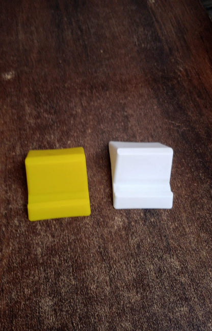 Compact plastic Wukusy mobile phone holder stand in mixed colors, lightweight and portable for hands-free device use.