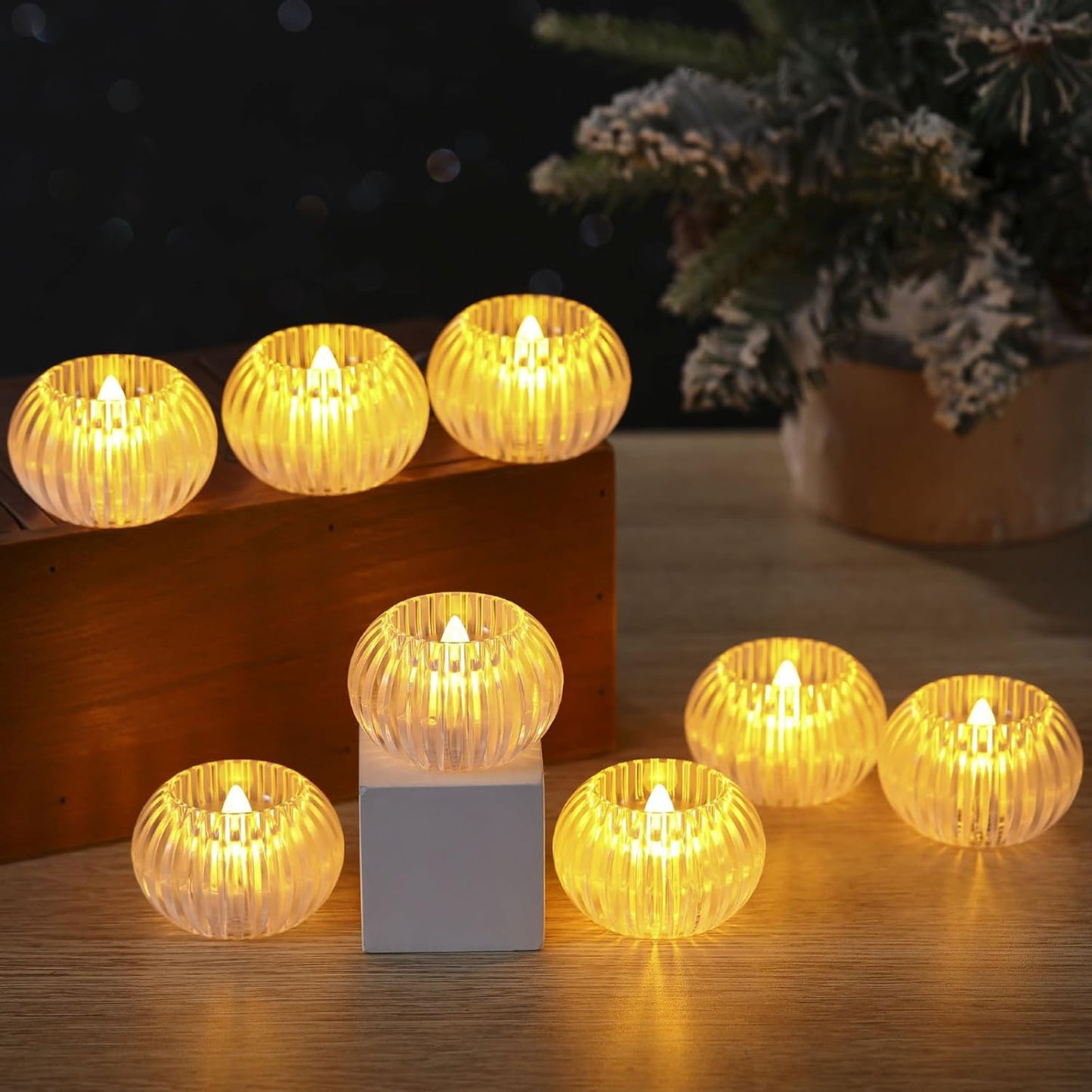 Set of 12 Wukusy LED crystal-effect flameless decorative candles for home decor, with glowing, smokeless, and flickering candle design.