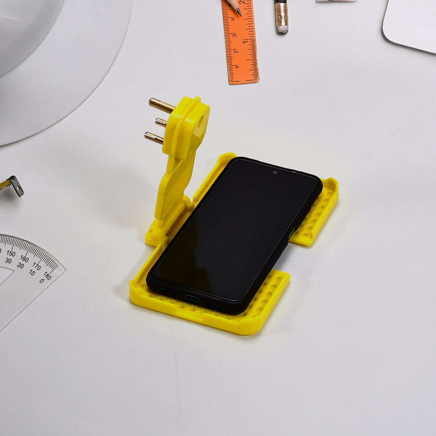 Wukusy 6498 yellow multi-purpose wall holder stand for mobile charging, fitting in socket and hanging devices.