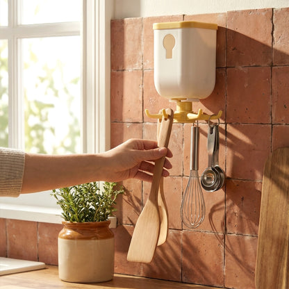 Wukusy 360 rotating heavy-duty sticky wall hook attached to a surface, showcasing its versatile wall storage and rotating design.