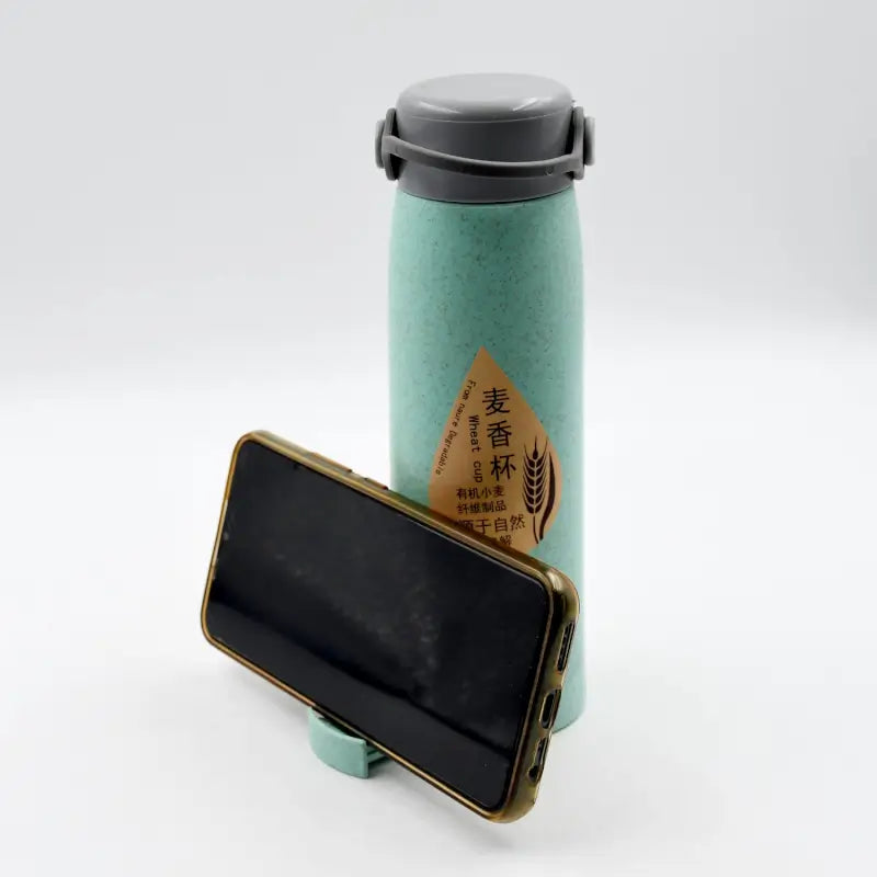 Ekom high portable glass water bottle with wheat fragrance design, wide mouth, 380ml capacity, and built-in mobile phone holder.