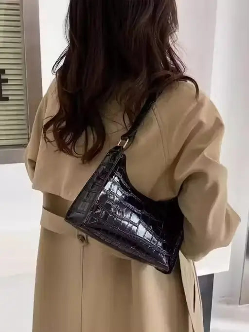 Ekom textured faux leather sling bag for women with adjustable crossbody strap and stylish design.