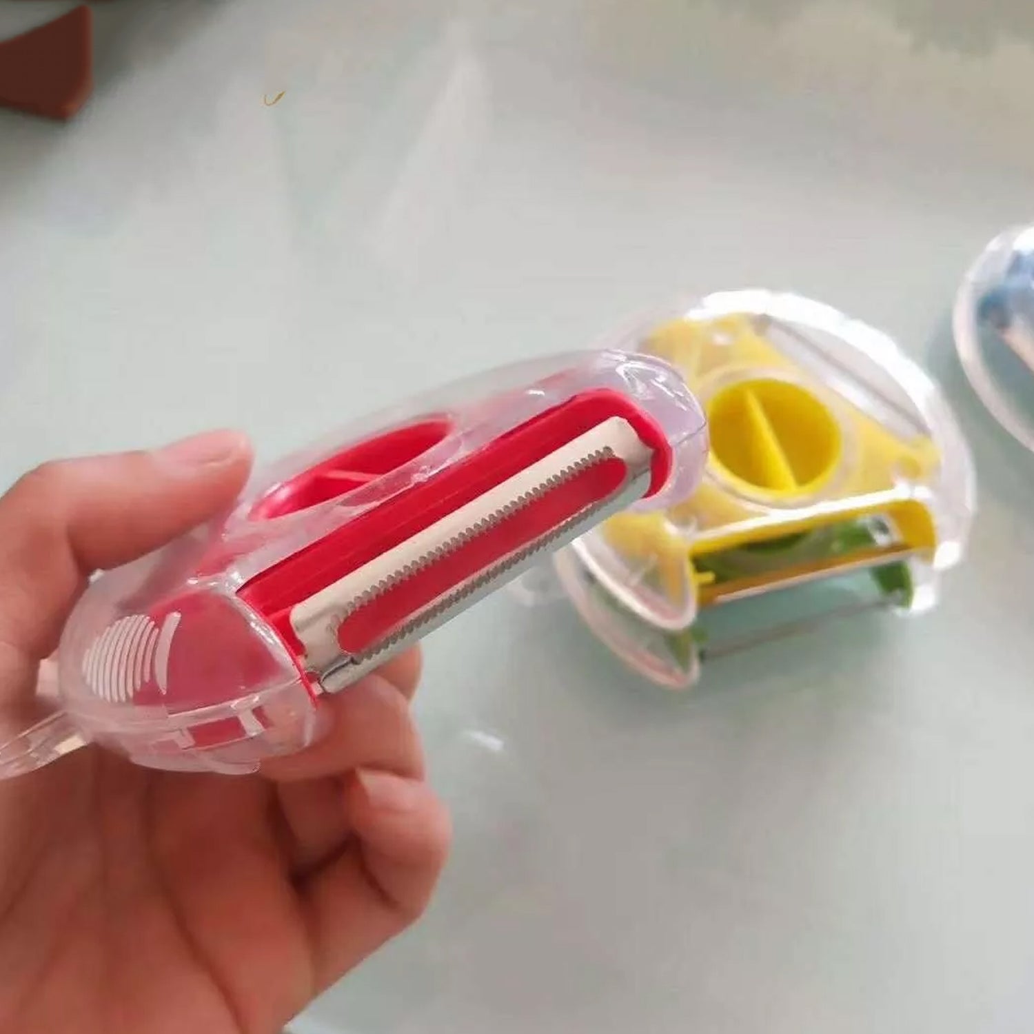 Wukusy 2774 round planer peeler and vegetable slicer with stainless steel blades for peeling and slicing vegetables in the kitchen.