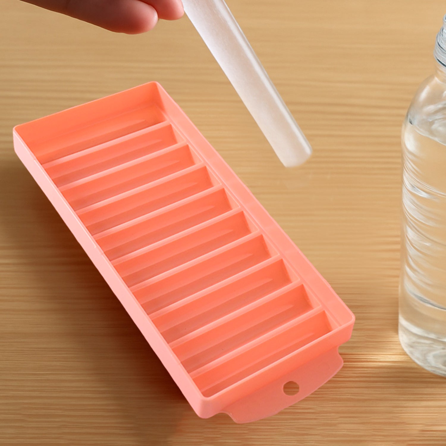 Wukusy compact plastic ice stick tray with 12 slots for making ice sticks, shown filled with water ready to freeze.