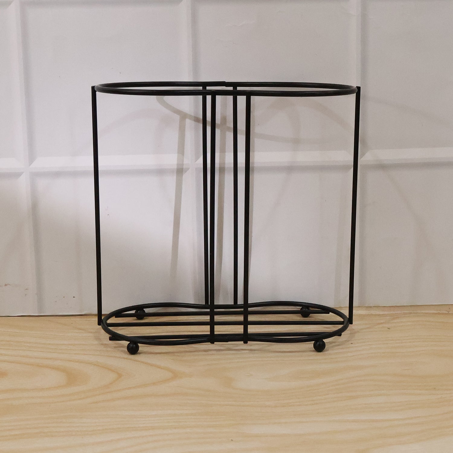 Metal desktop water cup holder by Wukusy, featuring a sleek, durable design for holding cups or bottles on a desk.