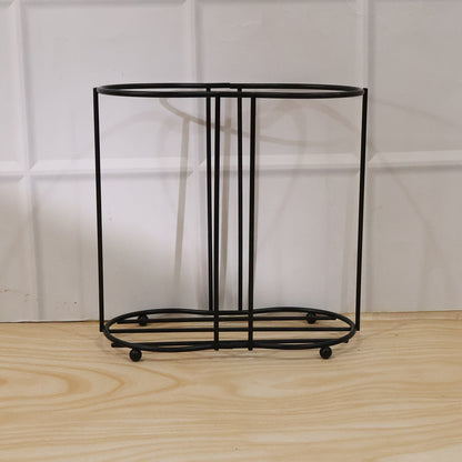 Metal desktop water cup holder by Wukusy, featuring a sleek, durable design for holding cups or bottles on a desk.
