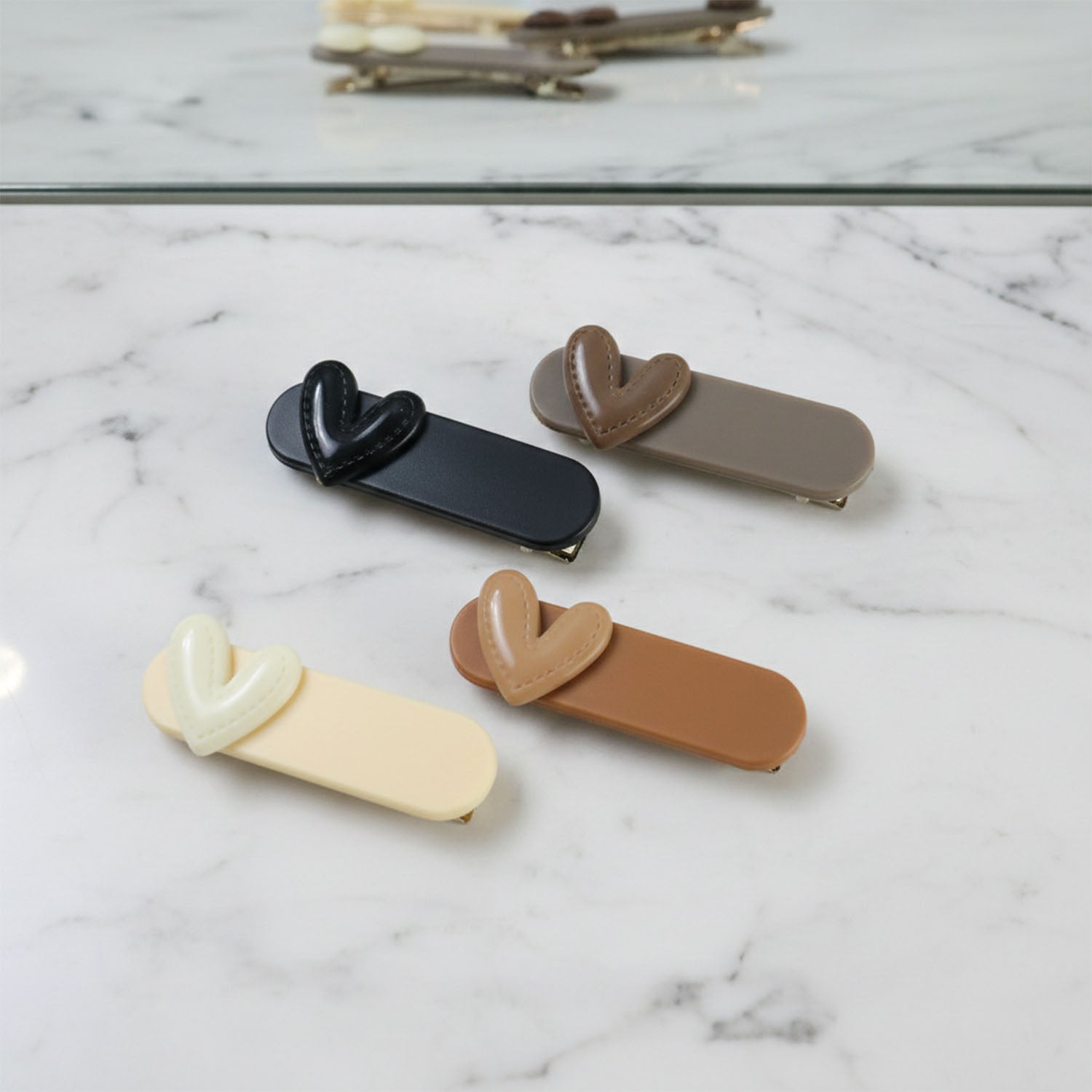 Set of four decorative Wukusy hair clips featuring colorful, stylish designs for adding a charming touch to hairstyles.