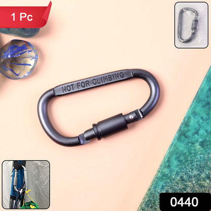 Heavy-duty metal carabiner hook with screw lock, Wukusy brand, used for home improvement, shown in close-up with secure locking mechanism.