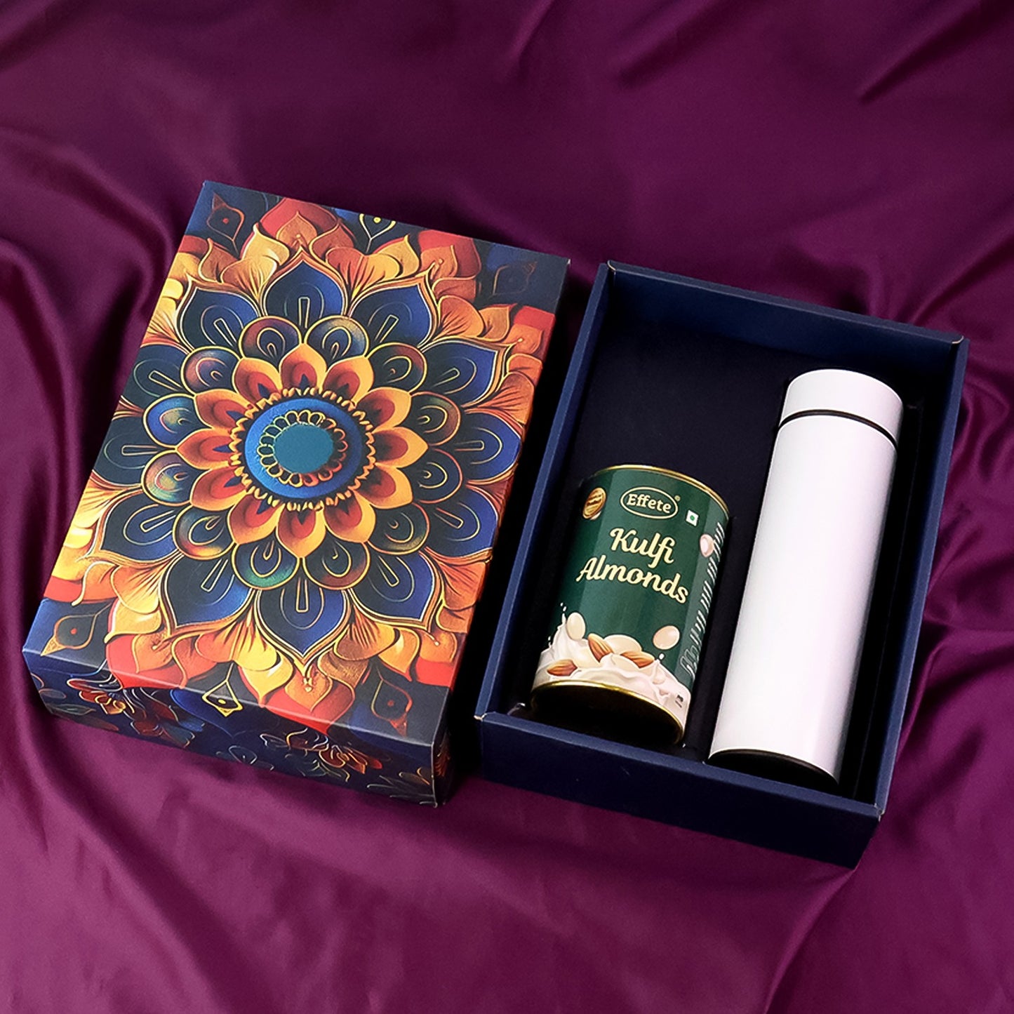 Wukusy Effete Kulfi Almonds Gift Hamper with a golden box and a bottle, perfect for home and kitchen gifting, 2-piece set.