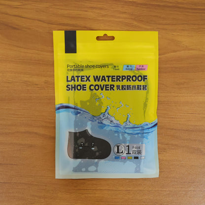 Pair of large waterproof silicone shoe covers by Wukusy, designed to keep footwear dry in wet conditions.