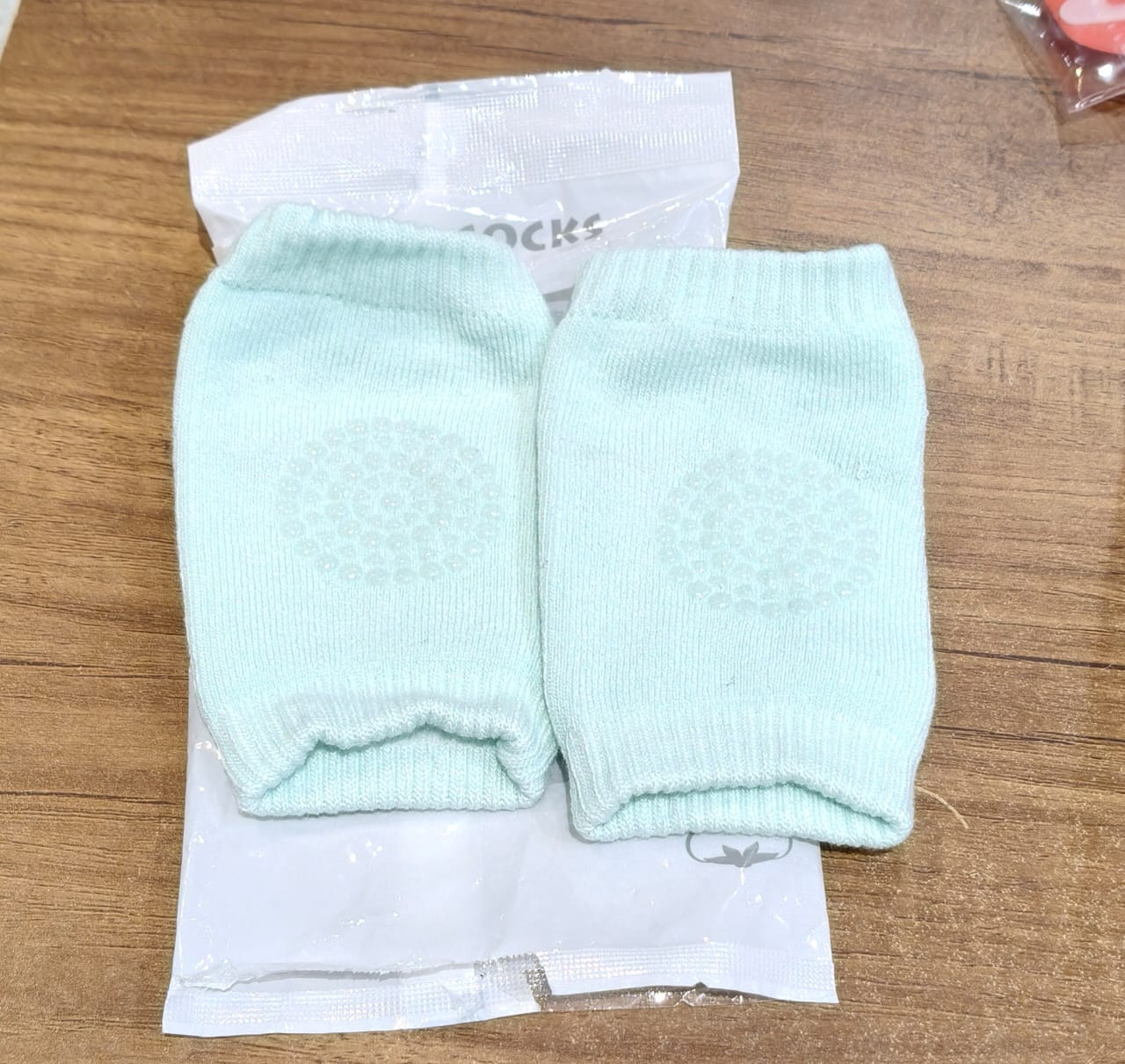 Mint green toddler wool knit leg warmer with knee guard, baby care accessory by Wukusy, soft and cozy for little ones.