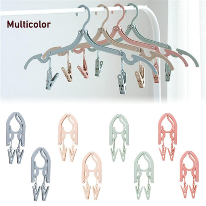 Wukusy folding clothes hanger with adjustable clips for hanging and drying garments, made of durable plastic material.