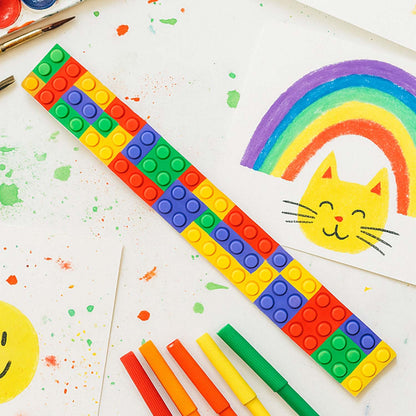 Colorful Snap Slap Bracelet toy set by Wukusy featuring 12 vibrant, flexible plastic bracelets suitable for kids' play.