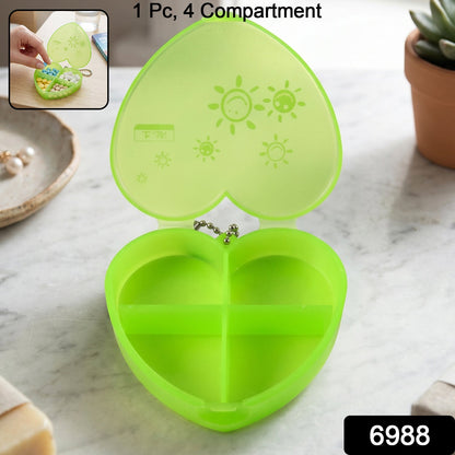 Heart-shaped plastic pill organizer box with 4 compartments and keychain, colorful and portable Wukusy design.