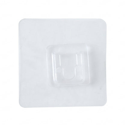 Clear self-adhesive wall hook by Wukusy attached to a wall, showing its transparent design and adhesive backing for easy hanging.