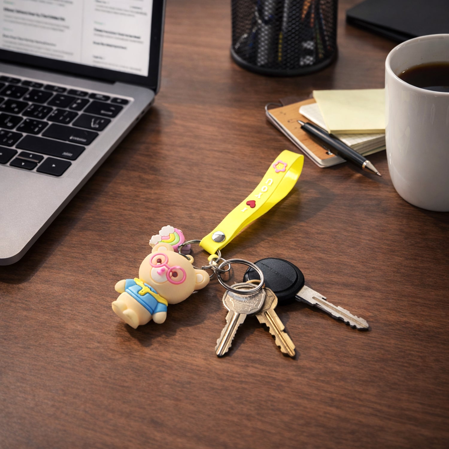Wukusy cute cartoon teddy bear keychain with yellow "I Love You" strap, featuring a plush teddy bear design and keyring attachment.