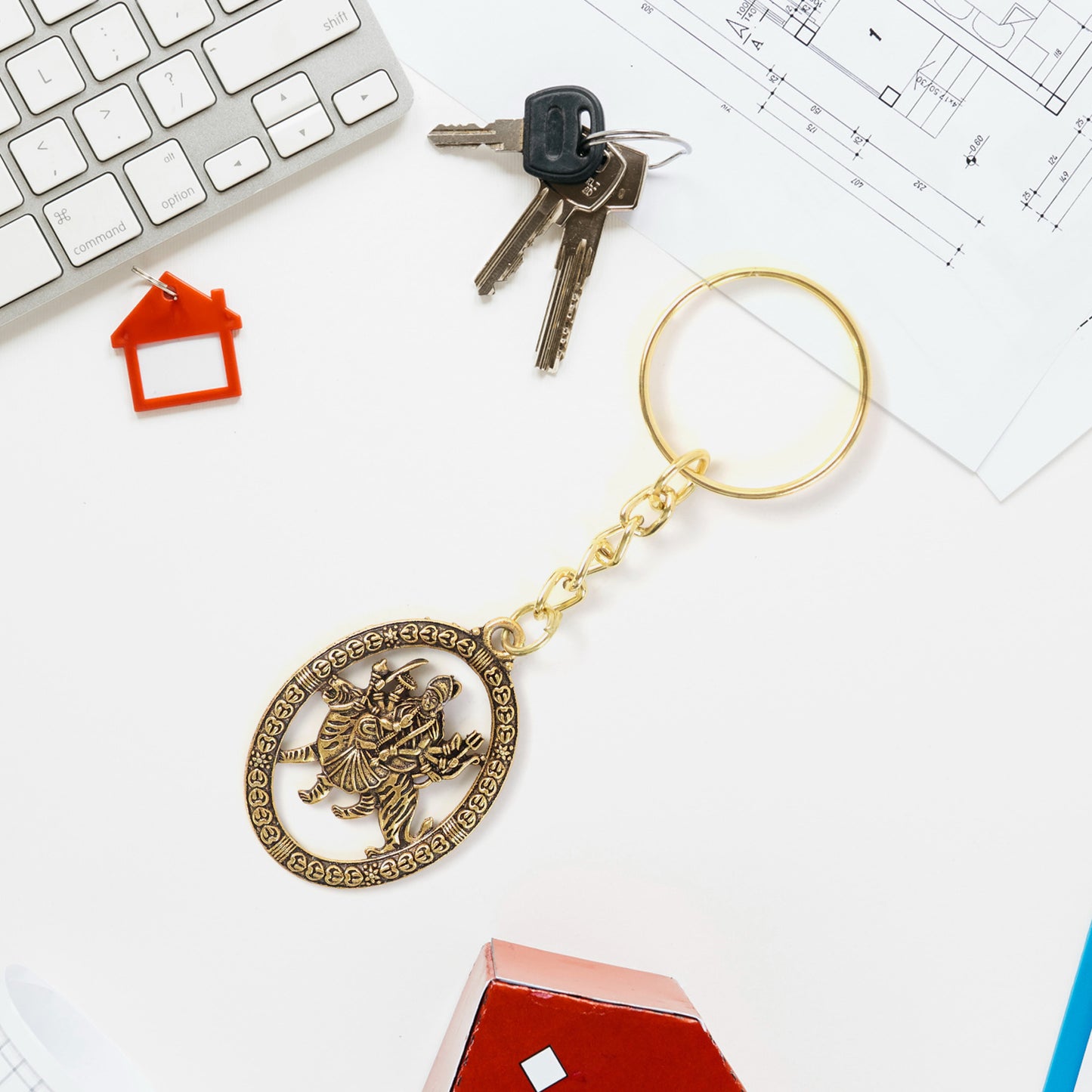 Golden metal Durga Maa keychain accessory with intricate design, featuring a detailed Durga Maa figure, by Wukusy.