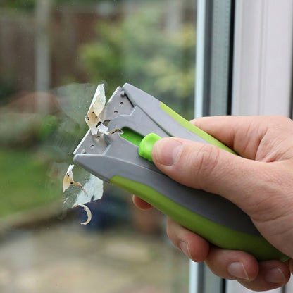 Wukusy multipurpose handheld glass surface scraper with ergonomic handle and replaceable blade for cleaning windows and glass.
