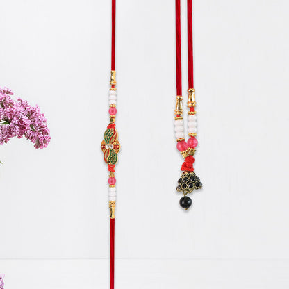 Elegant pink Bhabhi Lumba Rakhi with butterfly design, beaded tassels, and pink stone work, from Wukusy fashion collection.