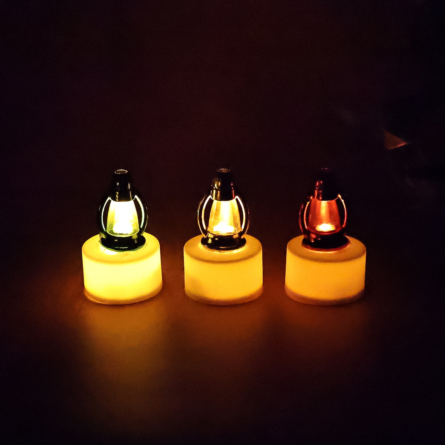 Six decorative LED lantern candles by Wukusy, showcasing warm glow and intricate design in a home decor setting
