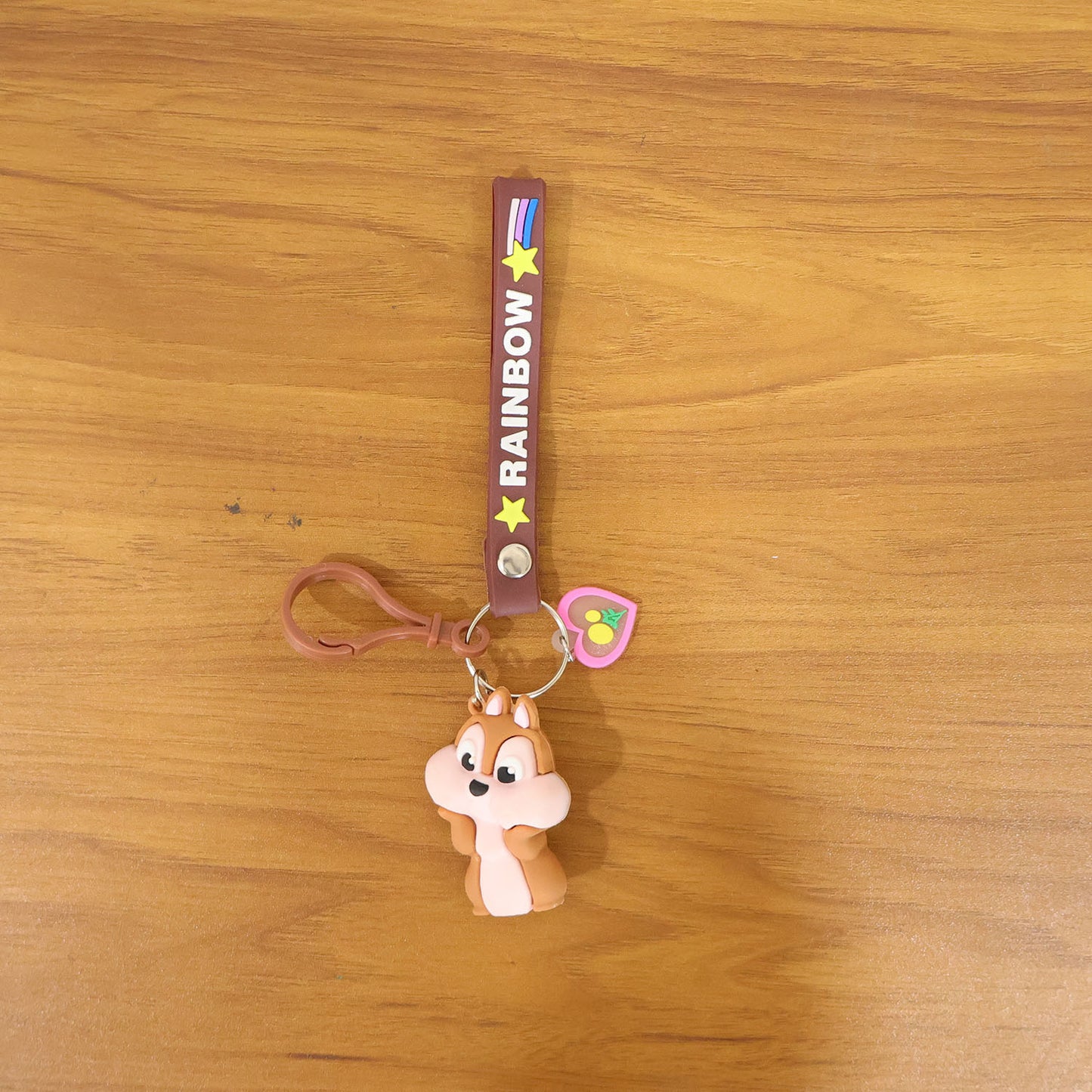 Cute cartoon animal silicone keychain with rainbow strap by Wukusy, featuring a colorful animal design on a keyring.