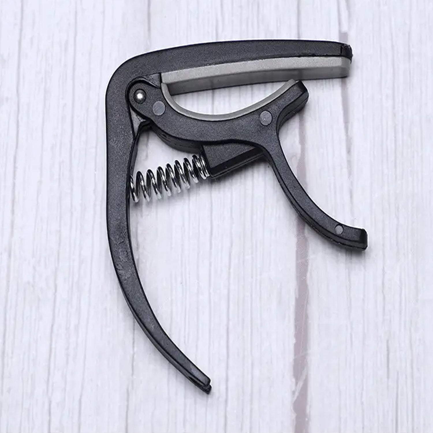 Wukusy 6141 guitar capo with pickup stand and soft pad for acoustic, electric guitar, ukulele, mandolin, and banjo accessories.