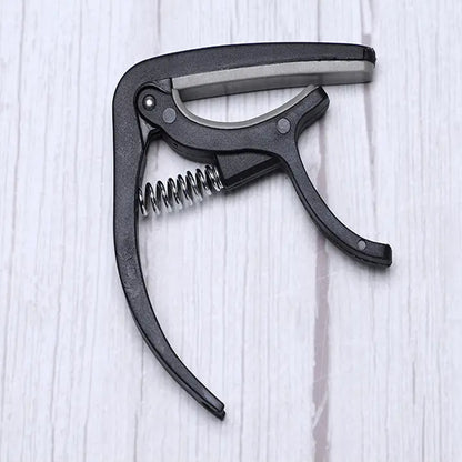 Wukusy 6141 guitar capo with pickup stand and soft pad for acoustic, electric guitar, ukulele, mandolin, and banjo accessories.