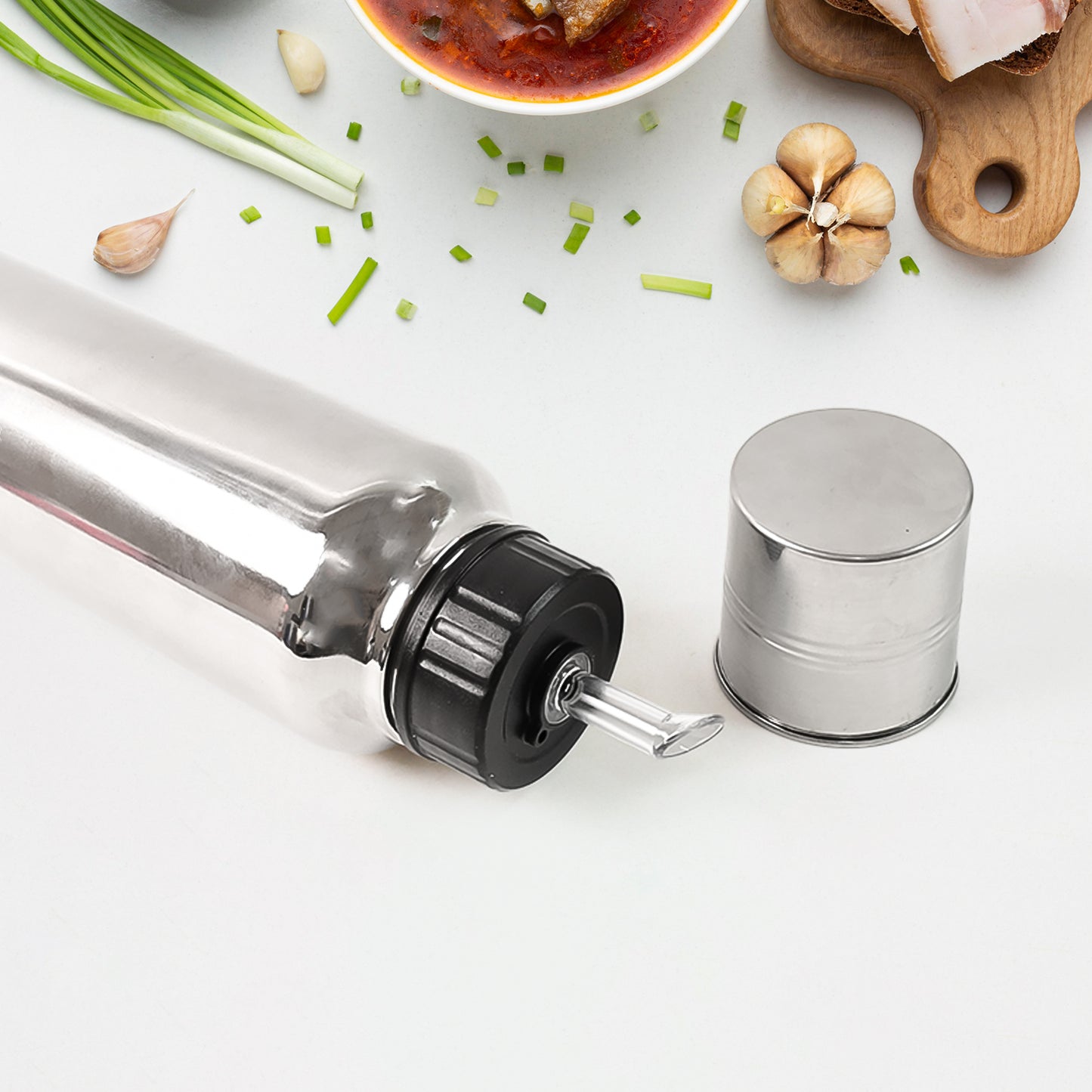 Wukusy Apex Pro stainless steel oil pourer, 750ml, with a sleek design and spout for precise oil pouring in the kitchen.