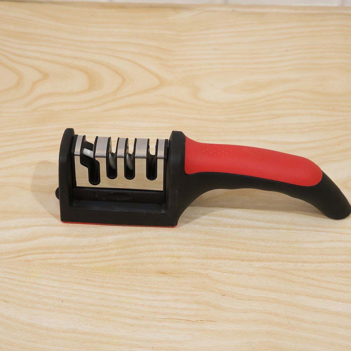 Wukusy 4-stage kitchen knife sharpener with non-slip handle, featuring multiple sharpening slots for precise edge honing.