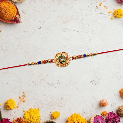 Traditional Kundan Rakhi with antique gold finish and multicolor beads, featuring intricate design by Wukusy for festive occasions