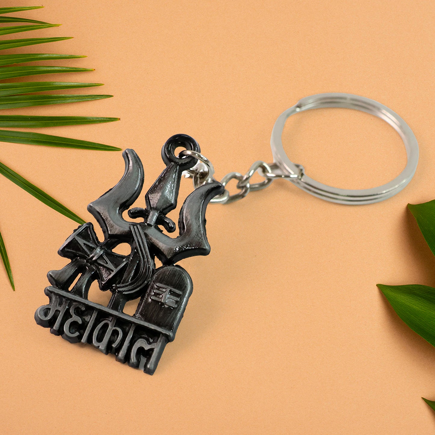 Wukusy Mahakal Trishul Damru design keychain featuring intricate Hindu symbol carvings on a metal keychain.