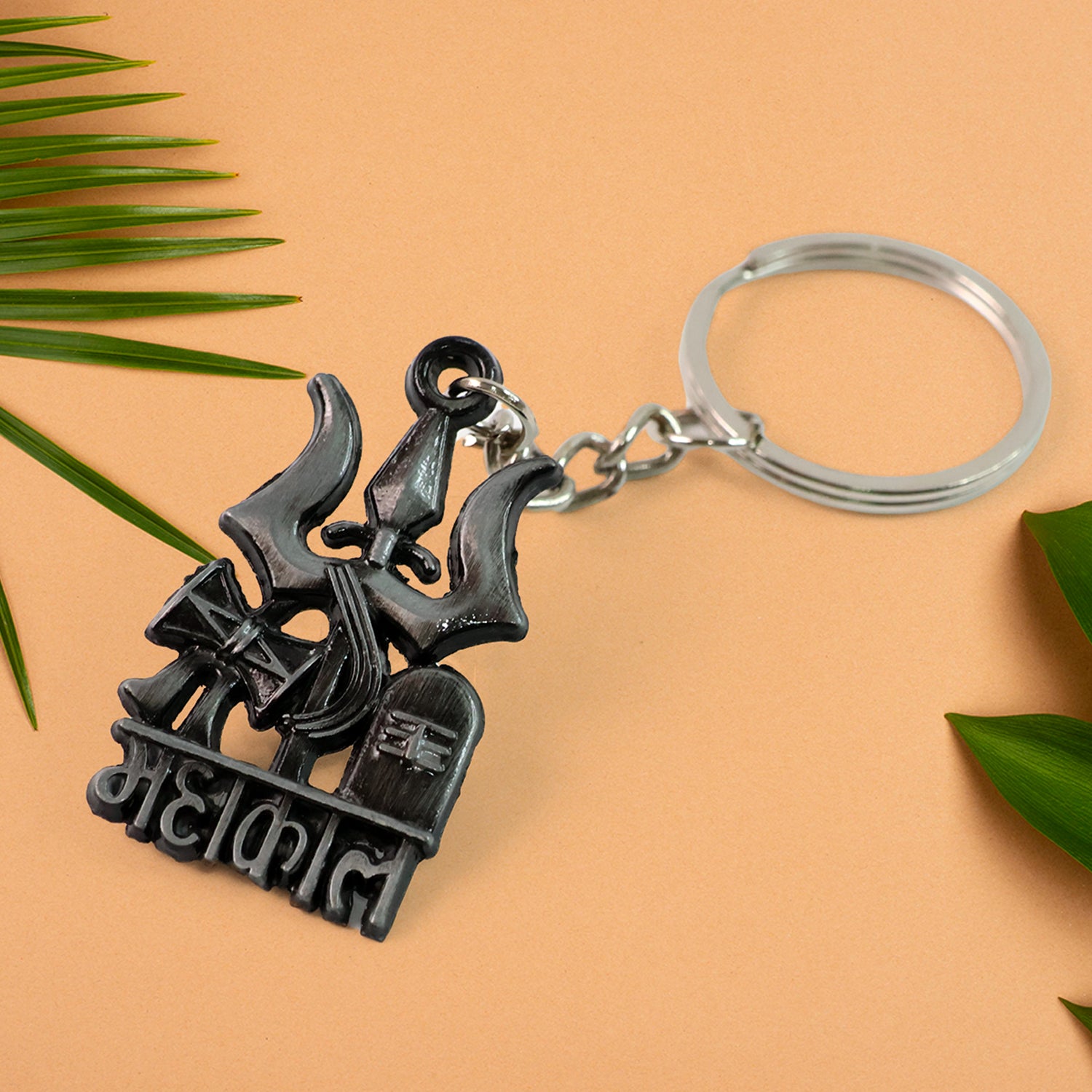 Wukusy Mahakal Trishul Damru design keychain featuring intricate Hindu symbol carvings on a metal keychain.
